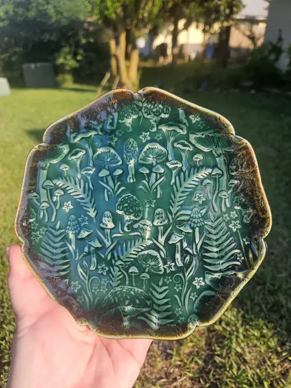 Magical Rainforest pottery plate with mushrooms, ferns, and forest creatures